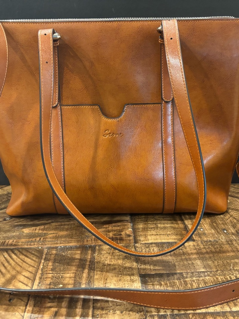 Tan Leather-Look Tote with Front Slip Pocket. Perfect for travel and electronics